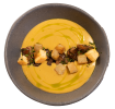 A bowl of beer cheese soup garnished with a line of croutons and oil.